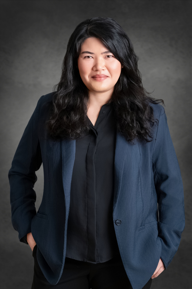 Female physician in a navy blazer photographed by Marc Weisberg for a professional headshot session in Orange County